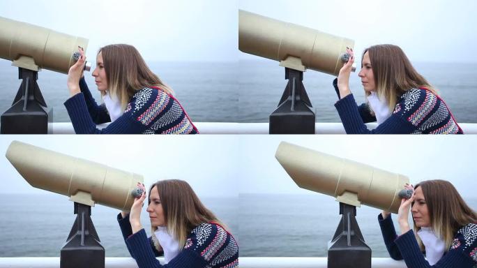 女人用双筒望远镜看。