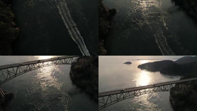 从海上驾驶的船到带有史诗般的照明镜头耀斑的过桥的汽车的空中平移