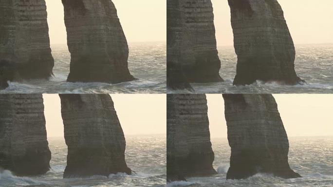 大浪在埃特雷塔的岩石悬崖上粉碎