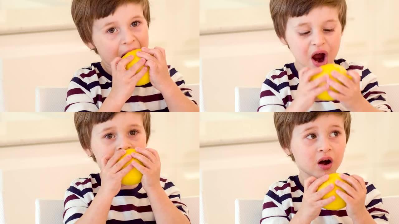 试图咬柠檬的小男孩