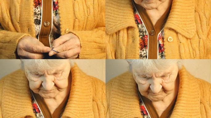 老妇人坐在家里编织衣服