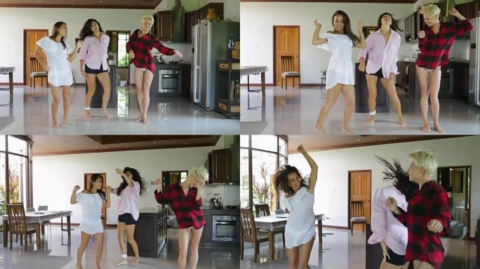 年轻女性在客厅在家跳舞，开朗迷人的女孩在现代公寓工作室玩得开心