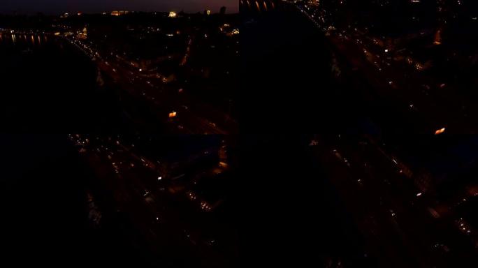 夜间欧洲城市的鸟瞰图，汽车，海滨照明。在4k超高清拍摄