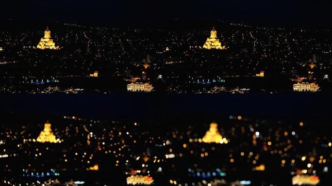 从上面散焦夜景欧洲城市。夜间汽车在路上的运动。老城区的夜灯