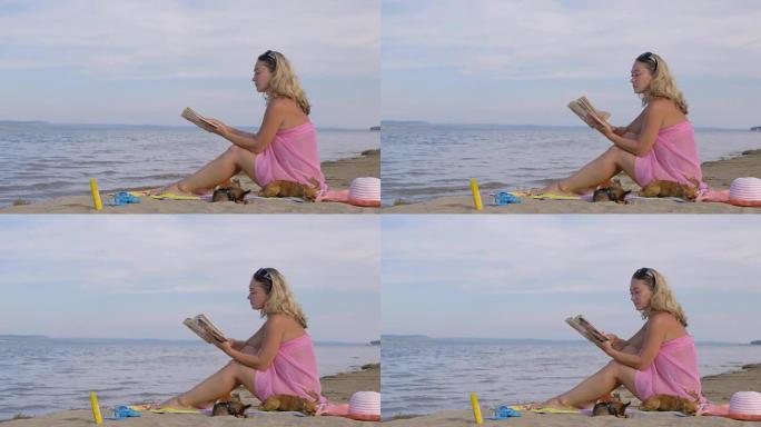 海滩上看书的女人。