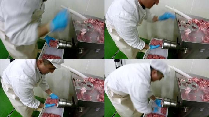 工人用绞肉机绞肉