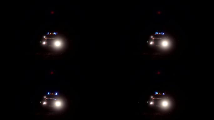 汽车救援卡车夜间闪烁蓝灯，道路上的消防车亮着灯，警笛声