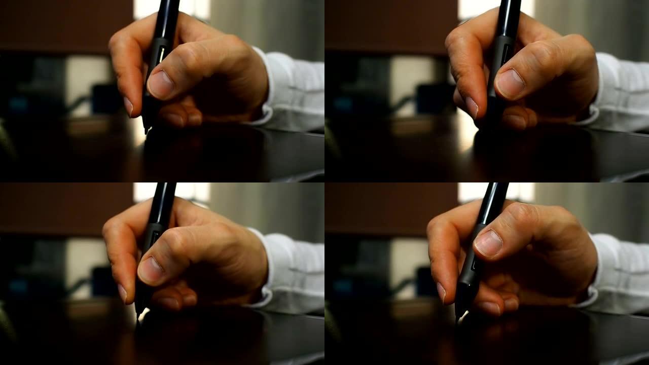 平板电脑19。拿着电子笔的平面设计师的手的特写。左视图