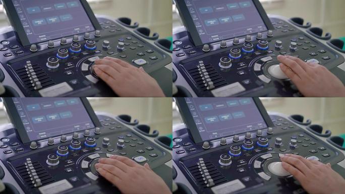 手部诊所医生的特写镜头，他调整控制面板上的x光设备，以便给病人的骨头拍照