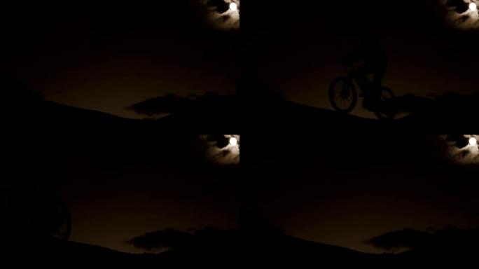 骑自行车的人晚上在山上骑自行车