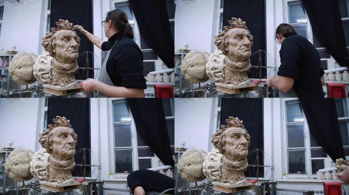 雕塑家造型雕塑调整面部细节用粘土制成的头部