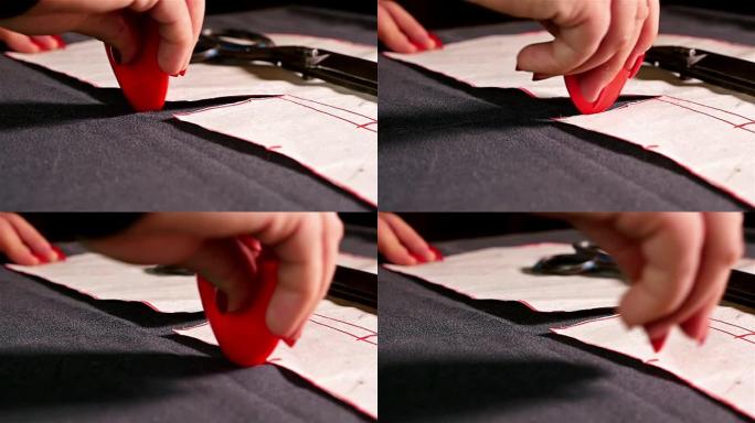 设计师测量用粉笔缝制的布