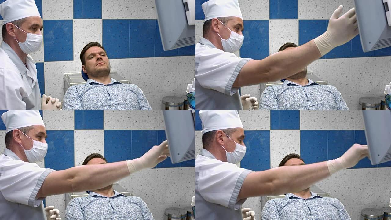 牙医在医疗制服上移动x射线图像在屏幕上