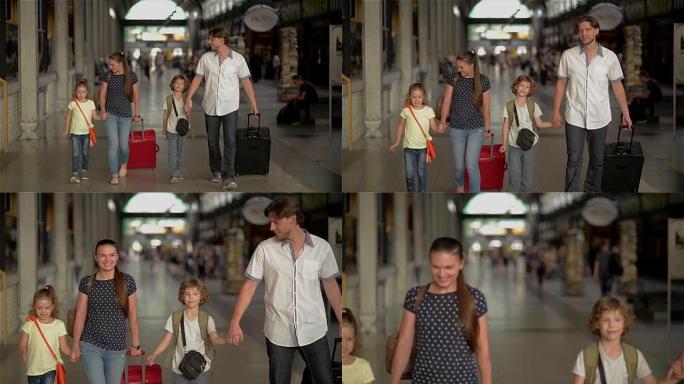 幸福的家庭，有孩子去火车站，父母和孩子在机场旅行和散步