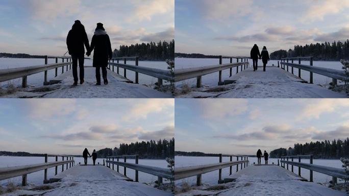 在斯堪的纳维亚半岛寒假期间，年轻夫妇一起散步