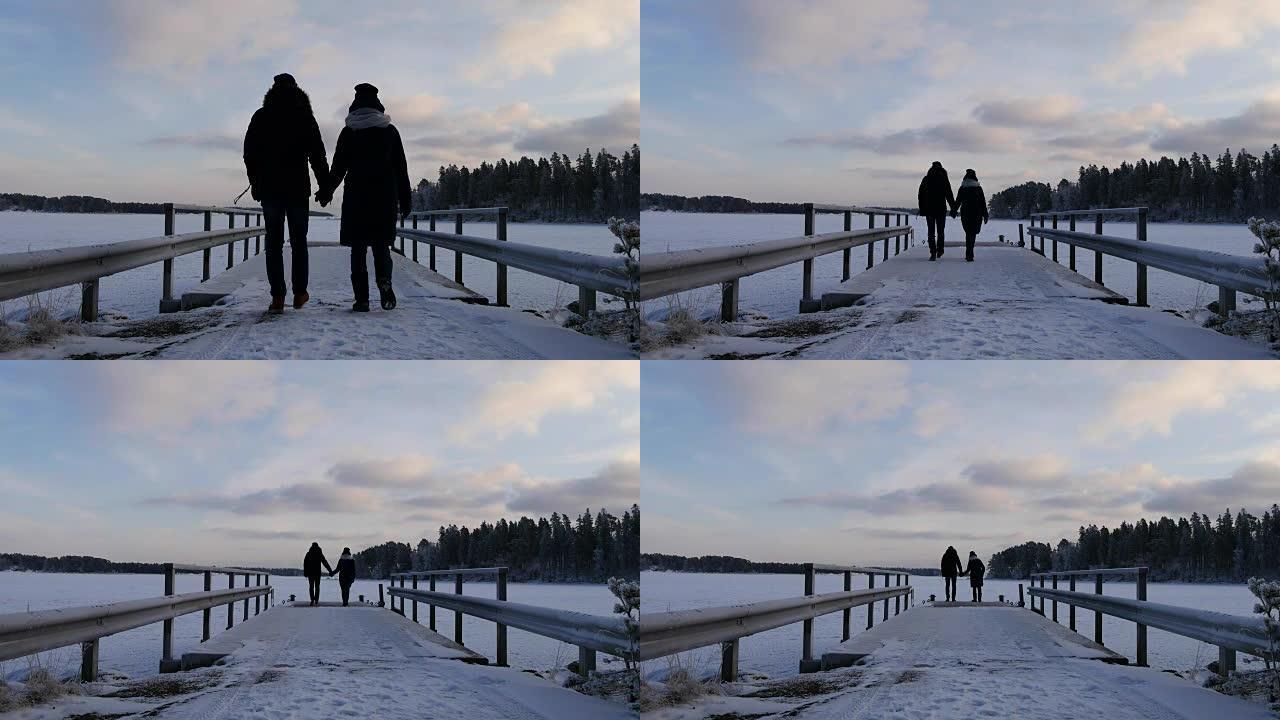 在斯堪的纳维亚半岛寒假期间，年轻夫妇一起散步