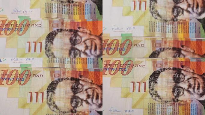 一堆100谢克尔的以色列钞票-向下倾斜