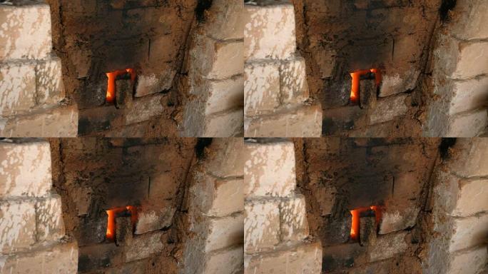 4k特写镜头，火焰和烟雾从瓷窑砖中冒出来。