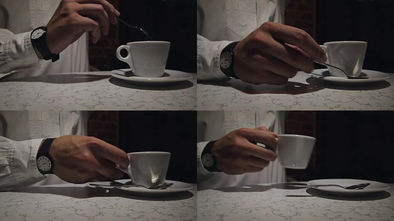 男子搅拌咖啡，特写，浅底。晚上