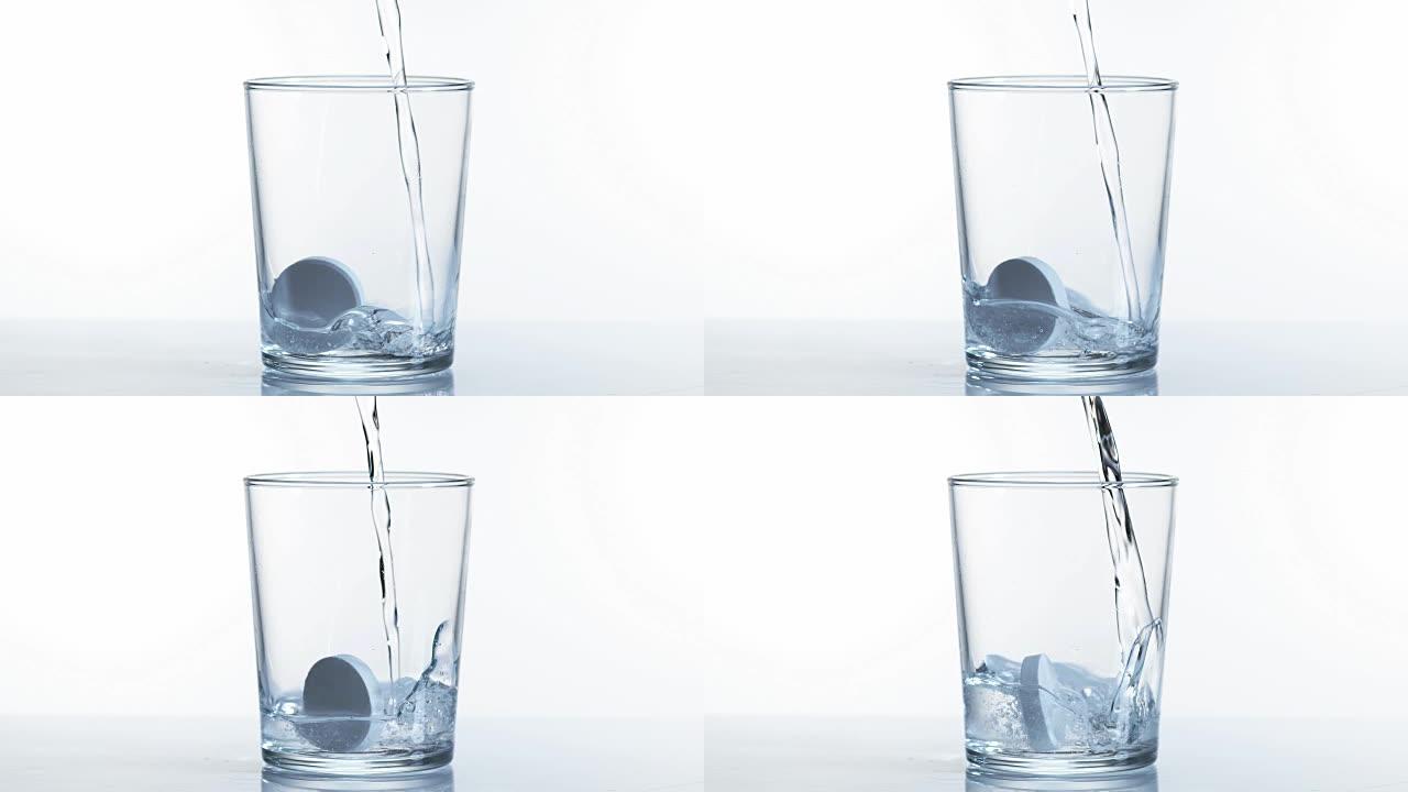 平板电脑溶解在白色背景下的一杯水中，慢动作4K