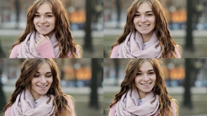 特写肖像 -- 美丽的年轻女子在城市对着镜头微笑