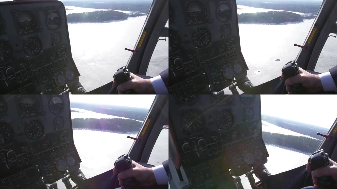 查看直升机的控制系统飞行员保持杆。驾驶舱的摄像头。冰湖上方。阳光明媚