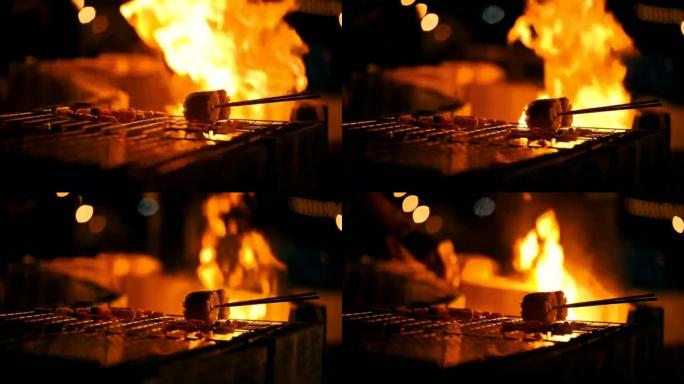 烤鸡串，烧烤，一群人在篝火上烧烤