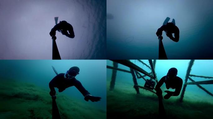 自由潜水者在水下走了一段时间，很深，也经过木头平台下。