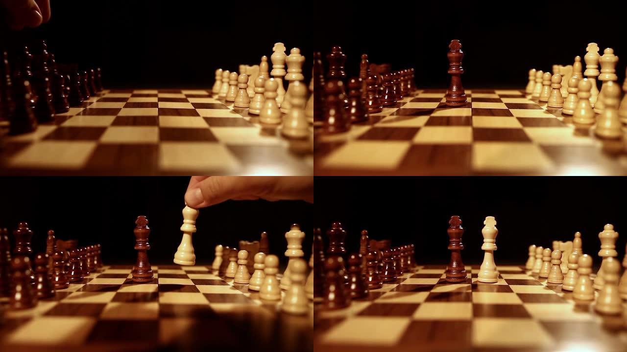 黑色背景上的棋盘镜头，两个国王被放在棋盘中间