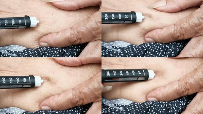关闭老妇人的手做注射胰岛素笔或注射器，药物，糖尿病，血糖，保健和人的概念。