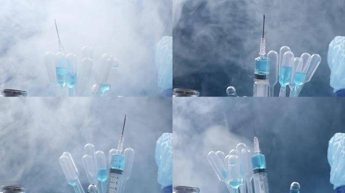 玻璃管测试实验室中的蓝色液体，滴管，注射器，模糊头盔，听诊器，手套和护目镜，在设备机器上旋转的管
