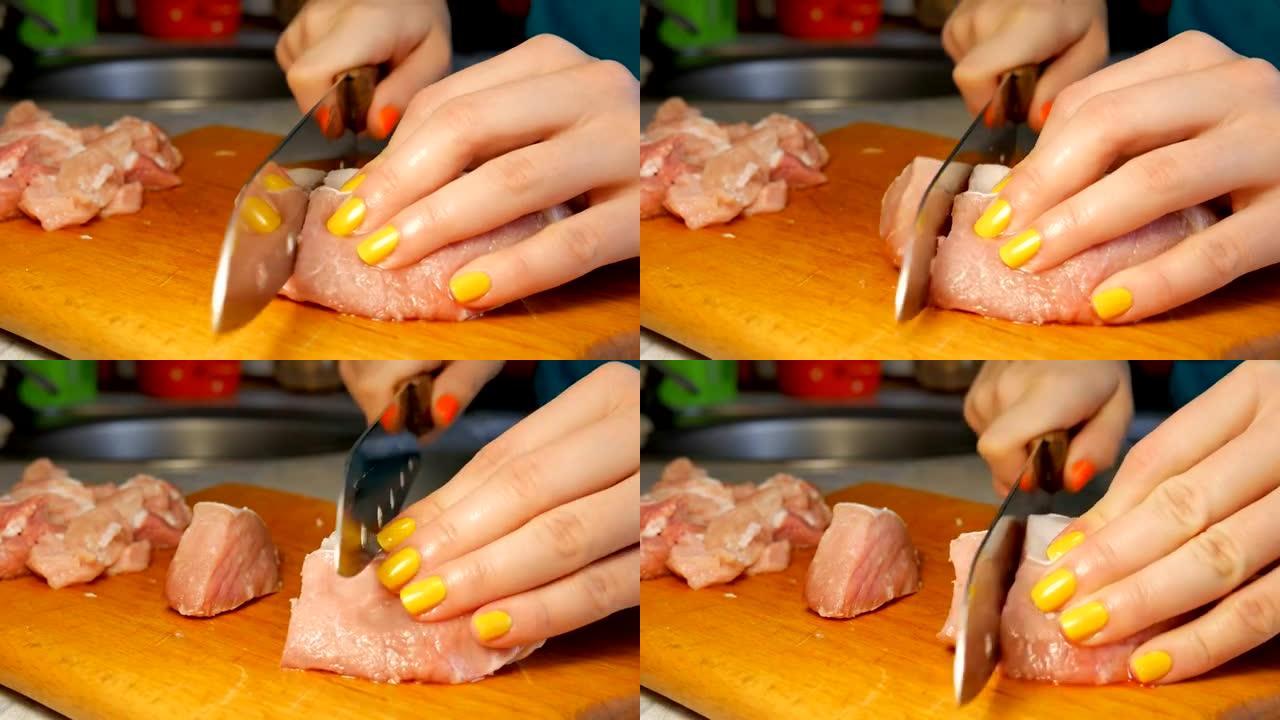女人手修指甲用刀割肉