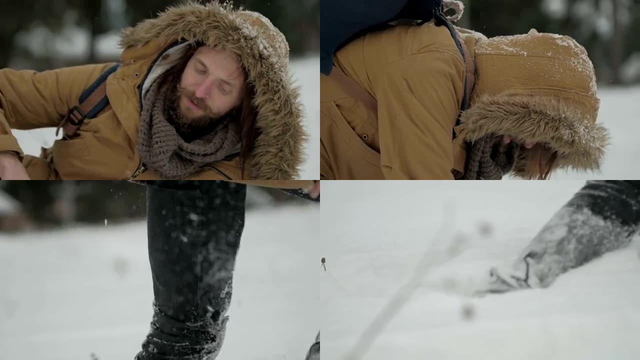 关于冬天的大自然的旅行者落在雪中