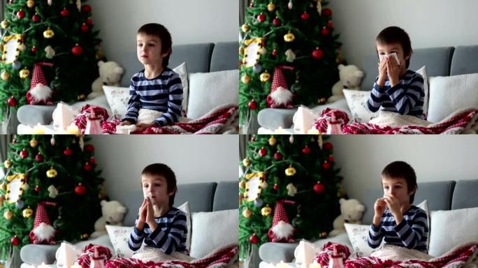 小孩，男孩，在圣诞节期间，他的鼻子和打喷嚏，躺在床上生病