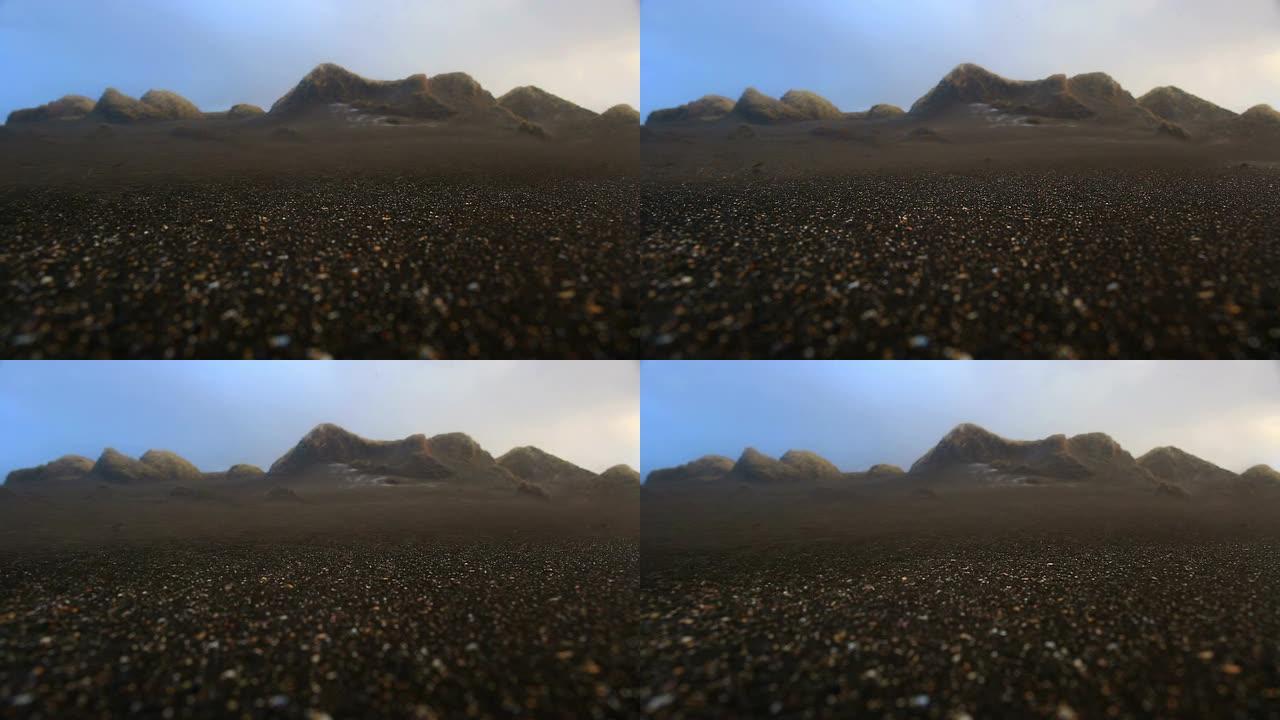 风吹拂的沙子在沙丘的海滩上盘旋，山特维克，冰岛
