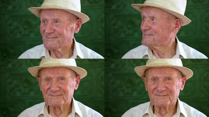 很有感情的老人肖像。祖父开心而微笑。肖像: 老年人，老年人。夏天，一个戴着白帽子的沉思老人独自坐在户