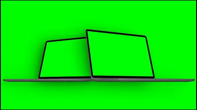 4k视频。两台笔记本电脑 (笔记本电脑) 在绿色背景上以绿色屏幕打开。