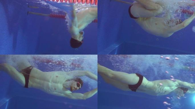 专业游泳者在水下转弯，用脚推开墙壁。