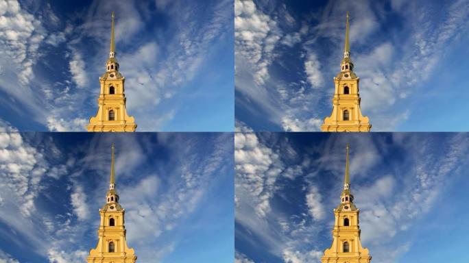 彼得和保罗大教堂的钟声响起，高高的金色尖顶在蓝色多云的天空中