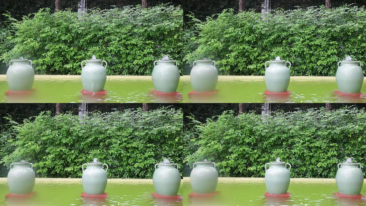 花园装饰的绿色陶瓷罐喷泉