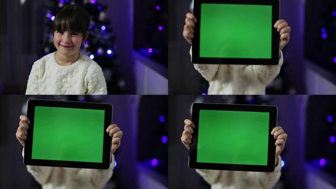 女孩拿着一台绿屏的平板电脑