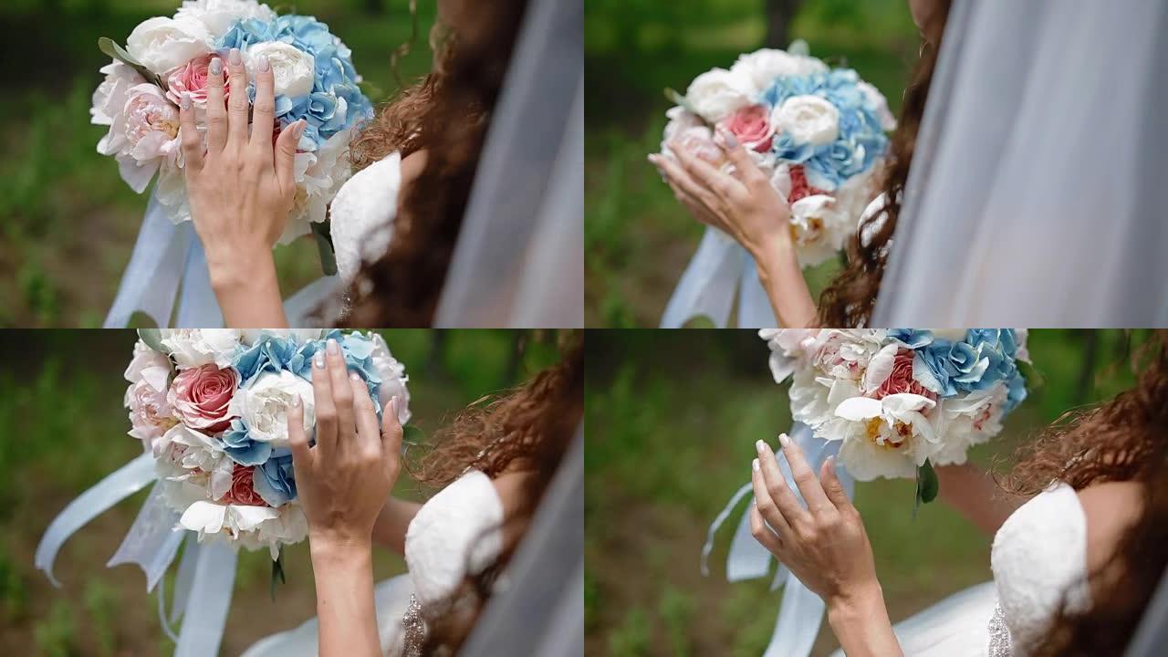 美丽的新娘摆出婚礼花束