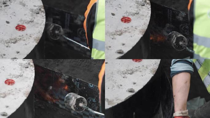 工人将黑色橡胶条融合在一起，将其粘在沟渠中的混凝土上。慢动作