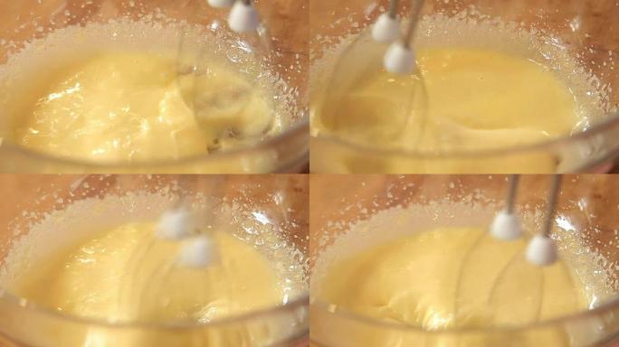 在玻璃碗中加糖搅拌鸡蛋