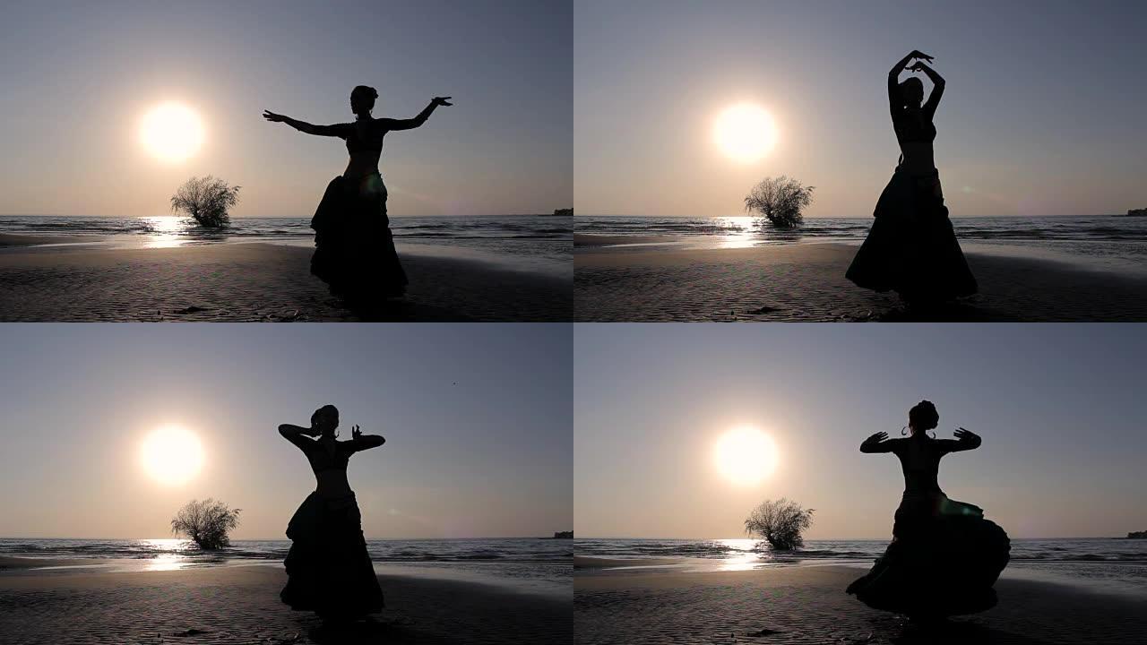 剪影女孩在海滩上跳舞异国情调的舞蹈