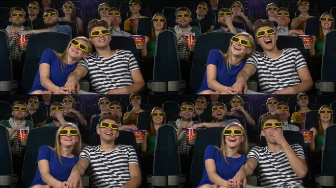 电影院里的夫妇用3D眼镜看电影