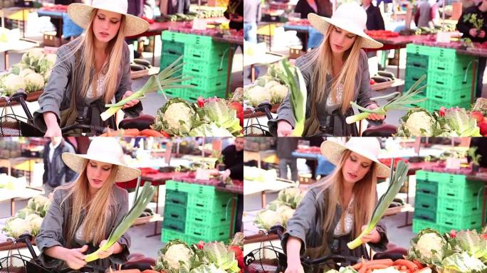 在市场上摘韭菜的漂亮女孩
