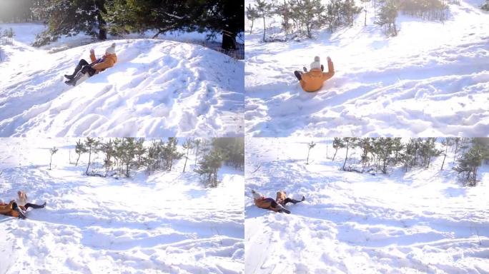 十几岁的女孩从冬天的雪公园的小山上雪橇，一只狗和一个开朗的女孩玩耍，在白雪皑皑的森林里阳光明媚的寒冷
