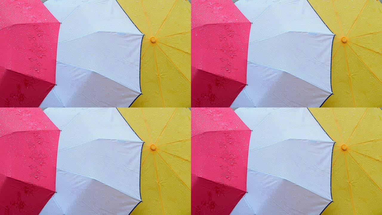 湿彩色雨伞背景