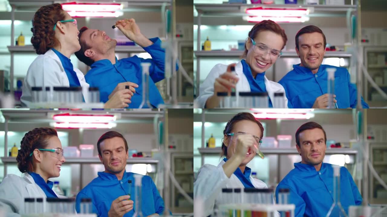 化学科学家在工作中很开心。化学研究人员在实验室里微笑